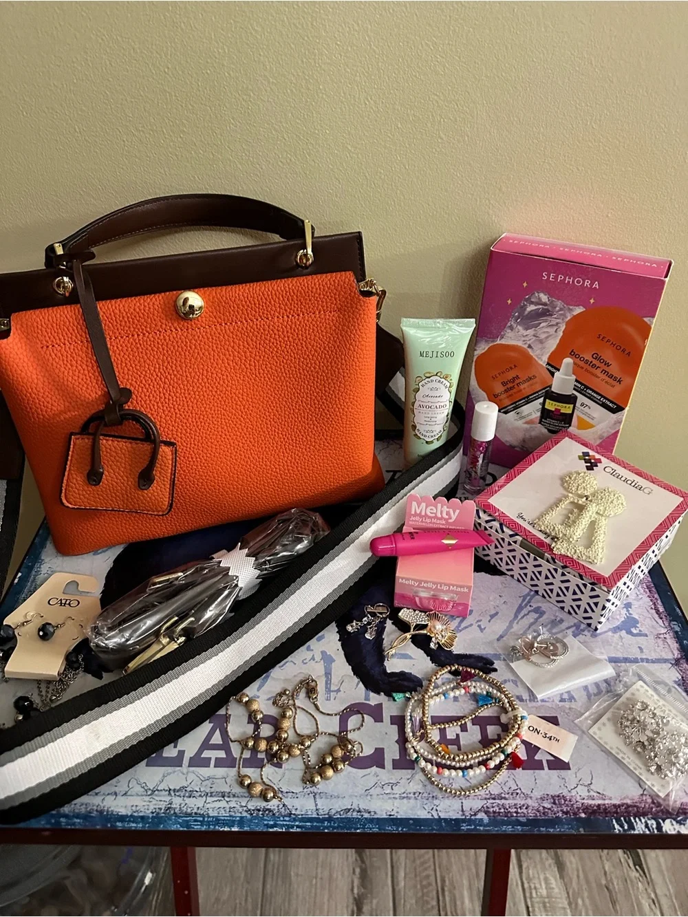 Orange hand Bag with Dark Brown Trim two crossbody straps..filled